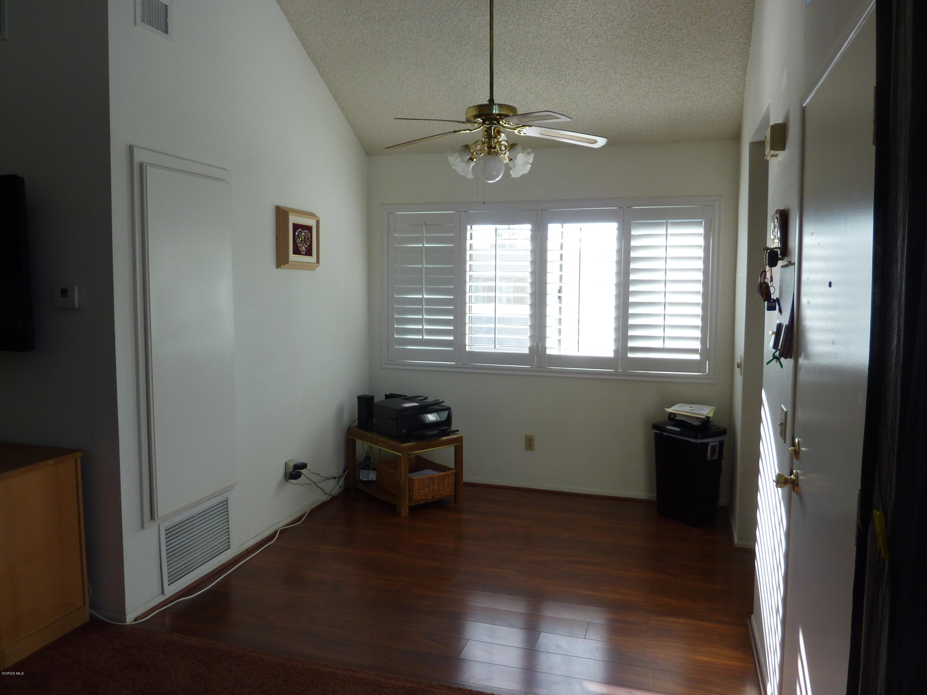 677 Arneill Road Camarillo, CA 93010 - Photo 12 of 40 a room that has a window and wooden floor