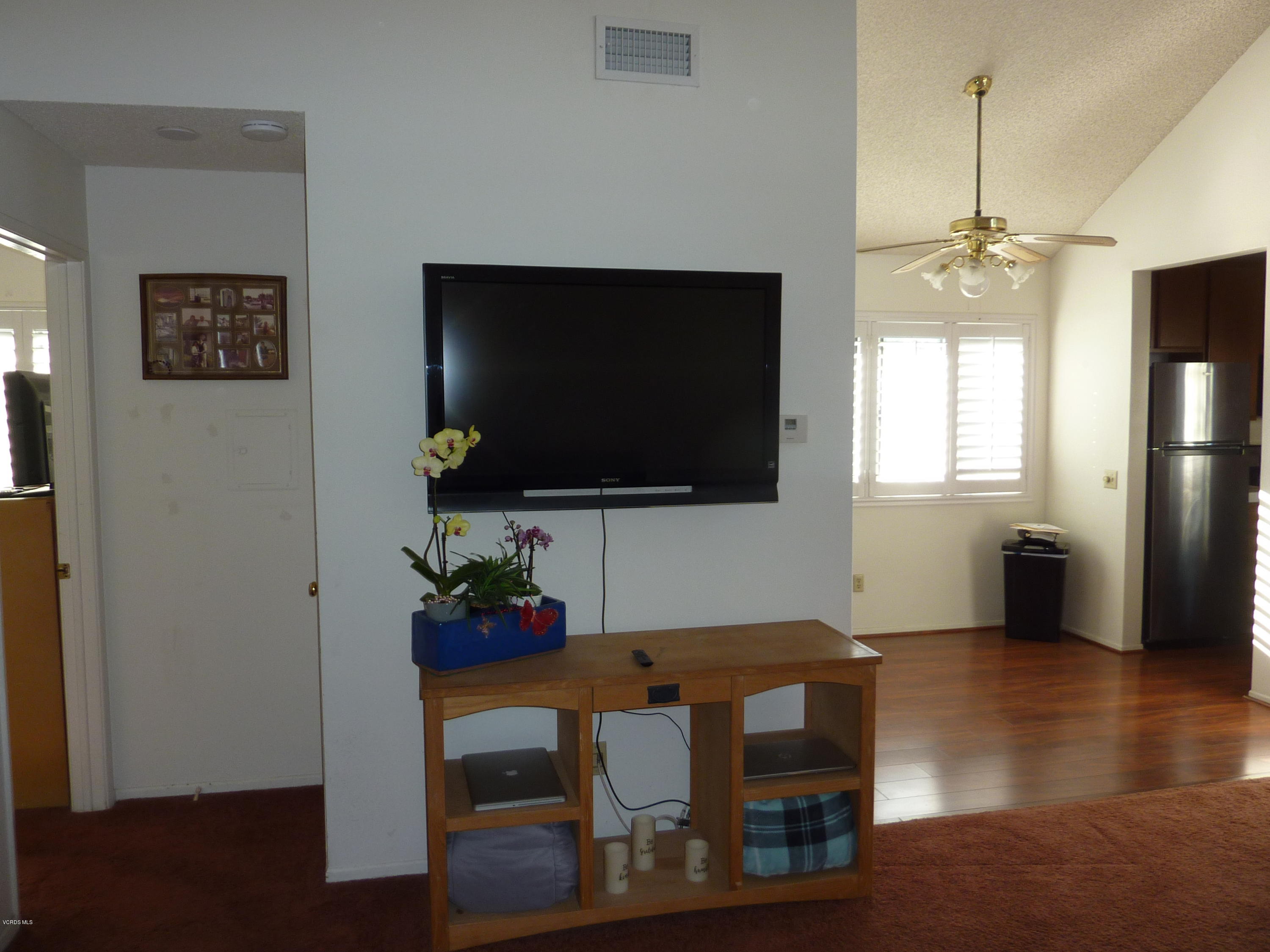 677 Arneill Road Camarillo, CA 93010 - Photo 14 of 40 a living room with furniture and a flat screen tv