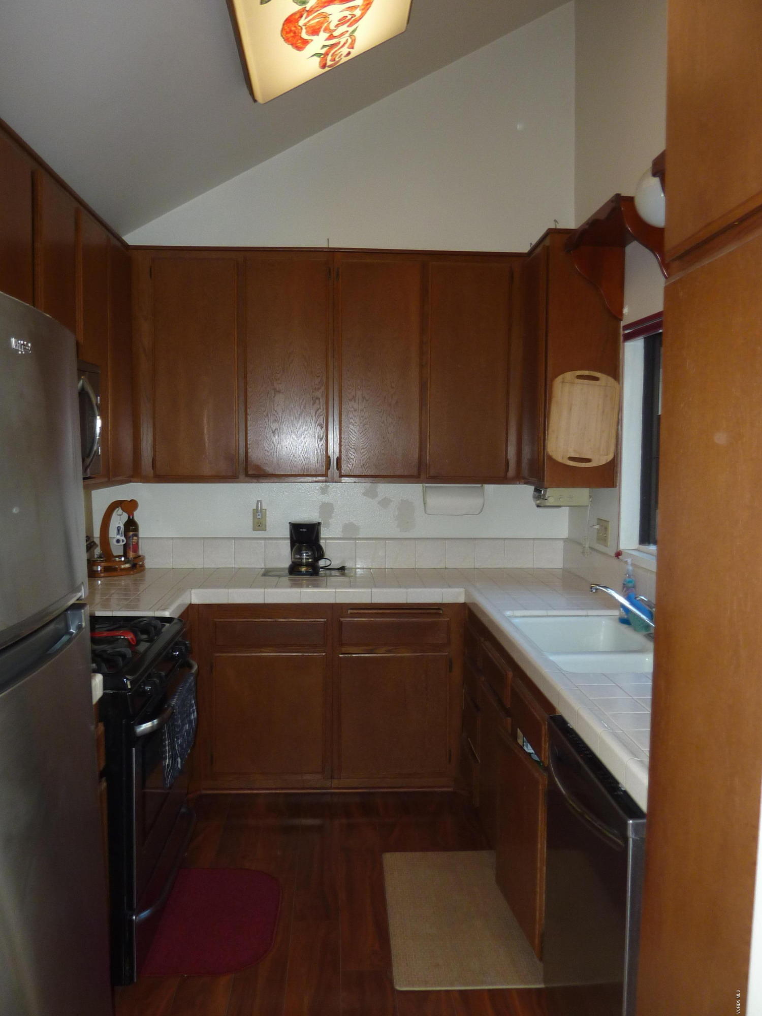 677 Arneill Road Camarillo, CA 93010 - Photo 17 of 40 a kitchen with a sink and cabinets