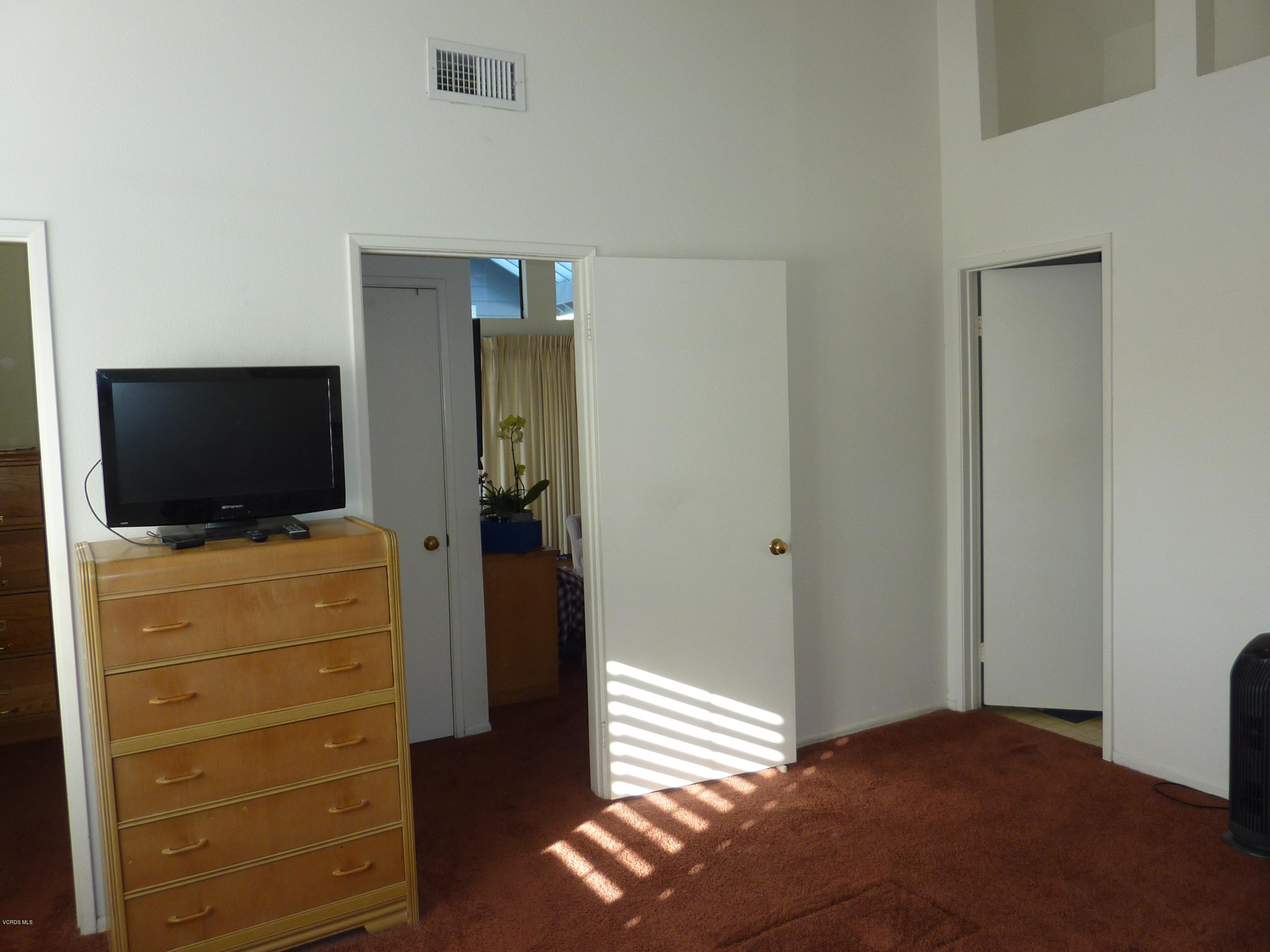 677 Arneill Road Camarillo, CA 93010 - Photo 20 of 40 a view of bedroom with a flat tv screen and dresser