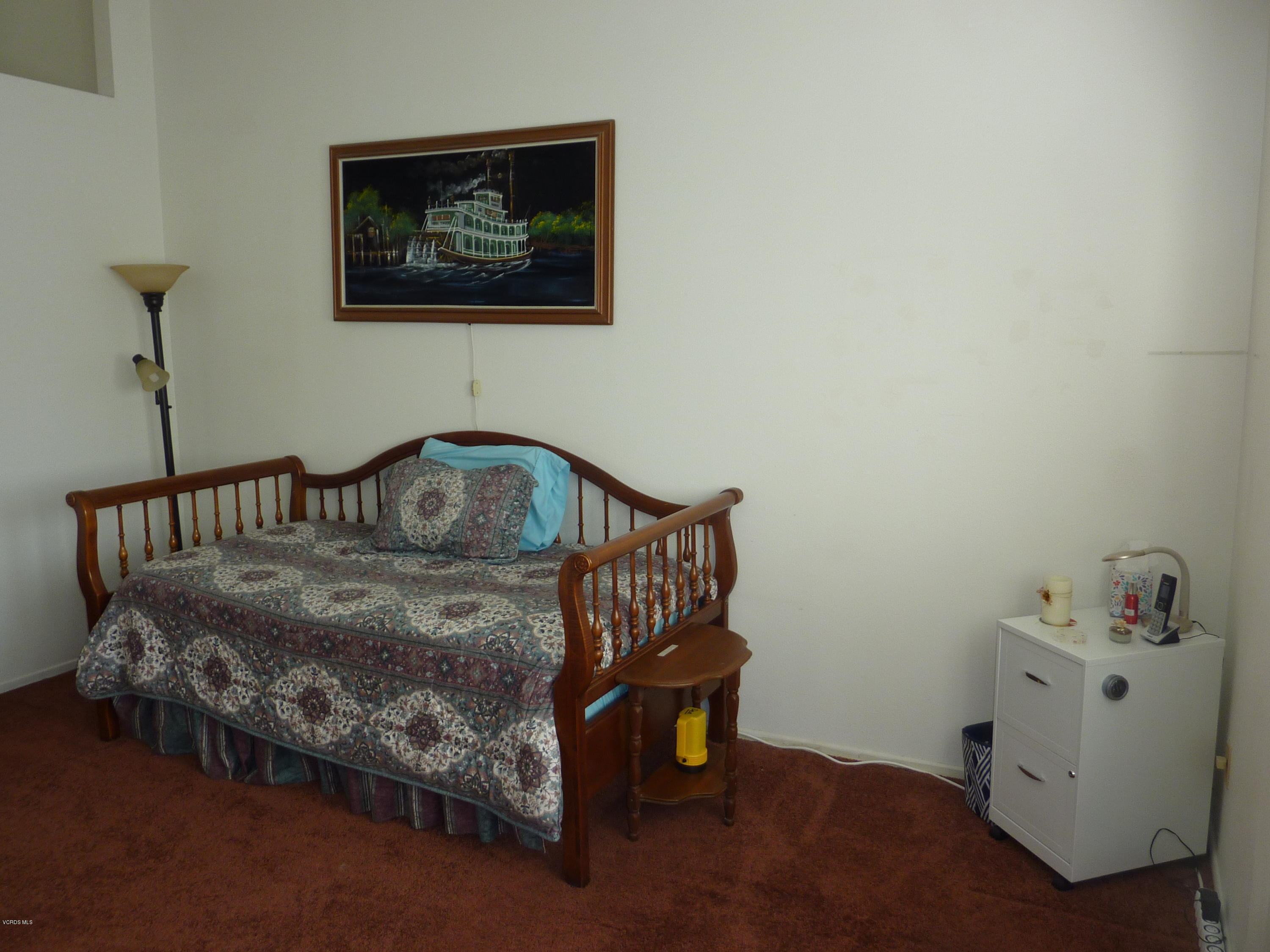 677 Arneill Road Camarillo, CA 93010 - Photo 22 of 40 a bedroom with a bed and a window
