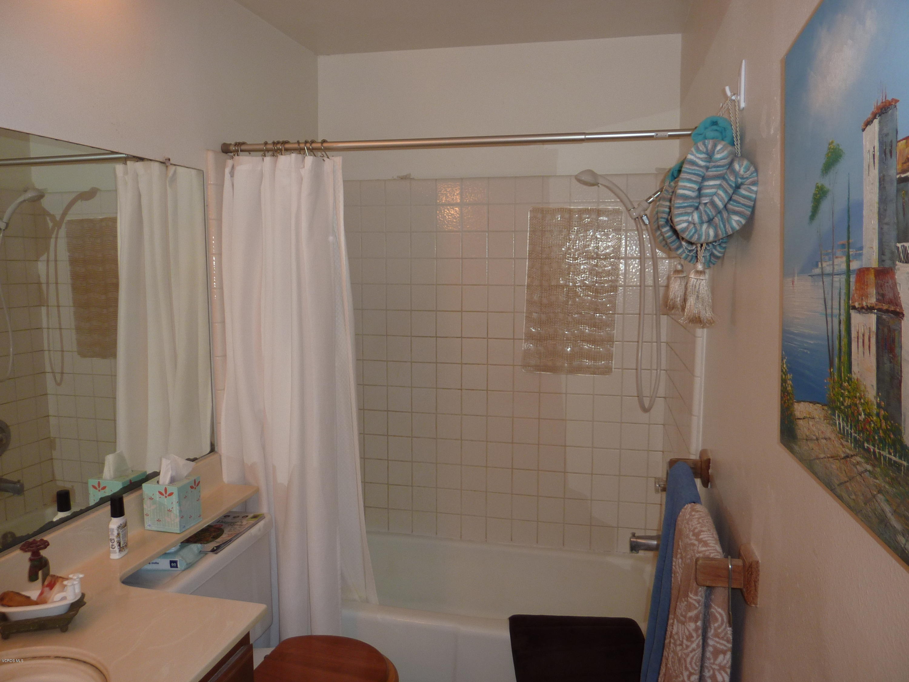 677 Arneill Road Camarillo, CA 93010 - Photo 24 of 40 a bathroom with a shower curtain and a sink