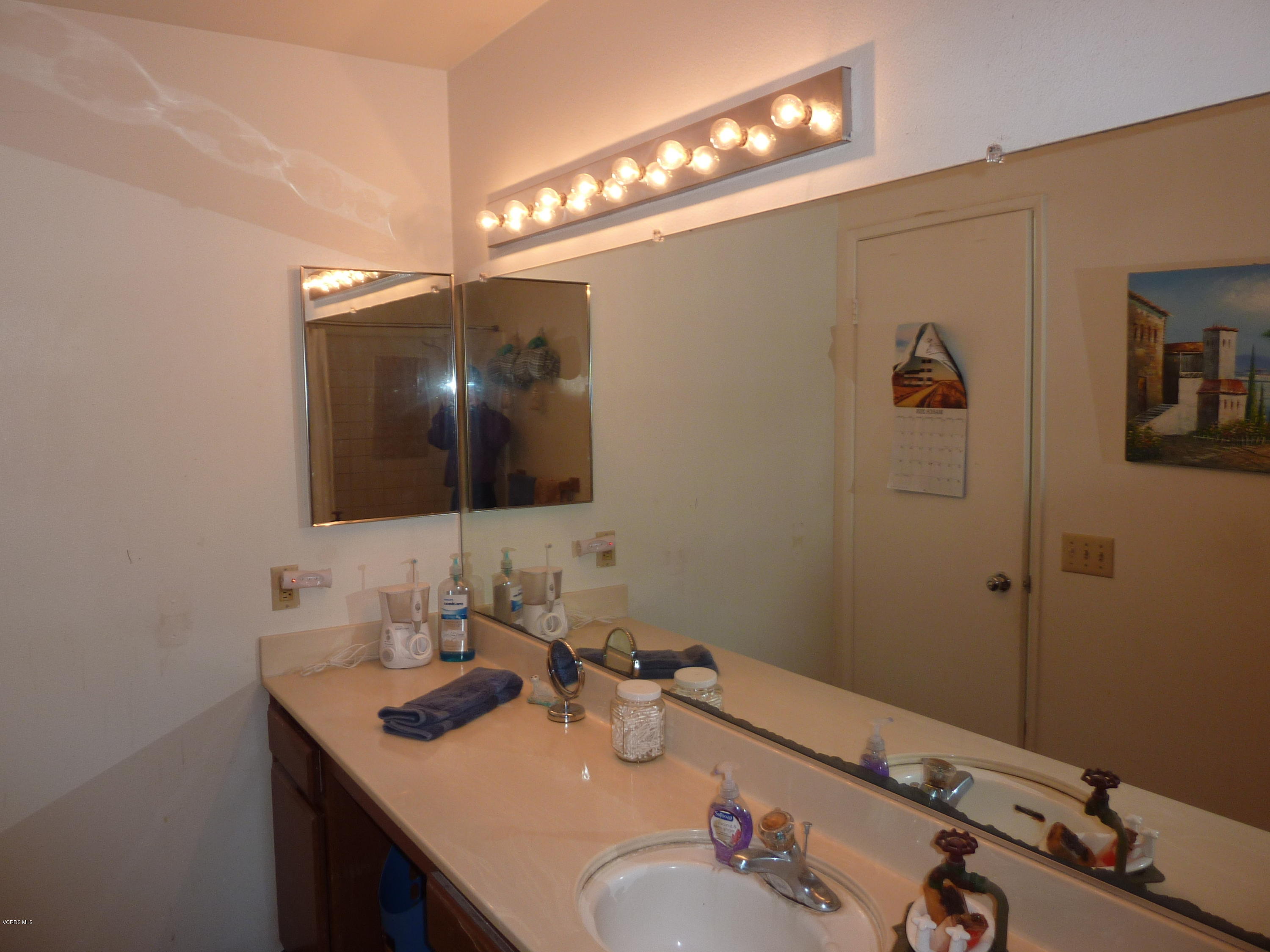 677 Arneill Road Camarillo, CA 93010 - Photo 25 of 40 a bathroom with a sink and a mirror