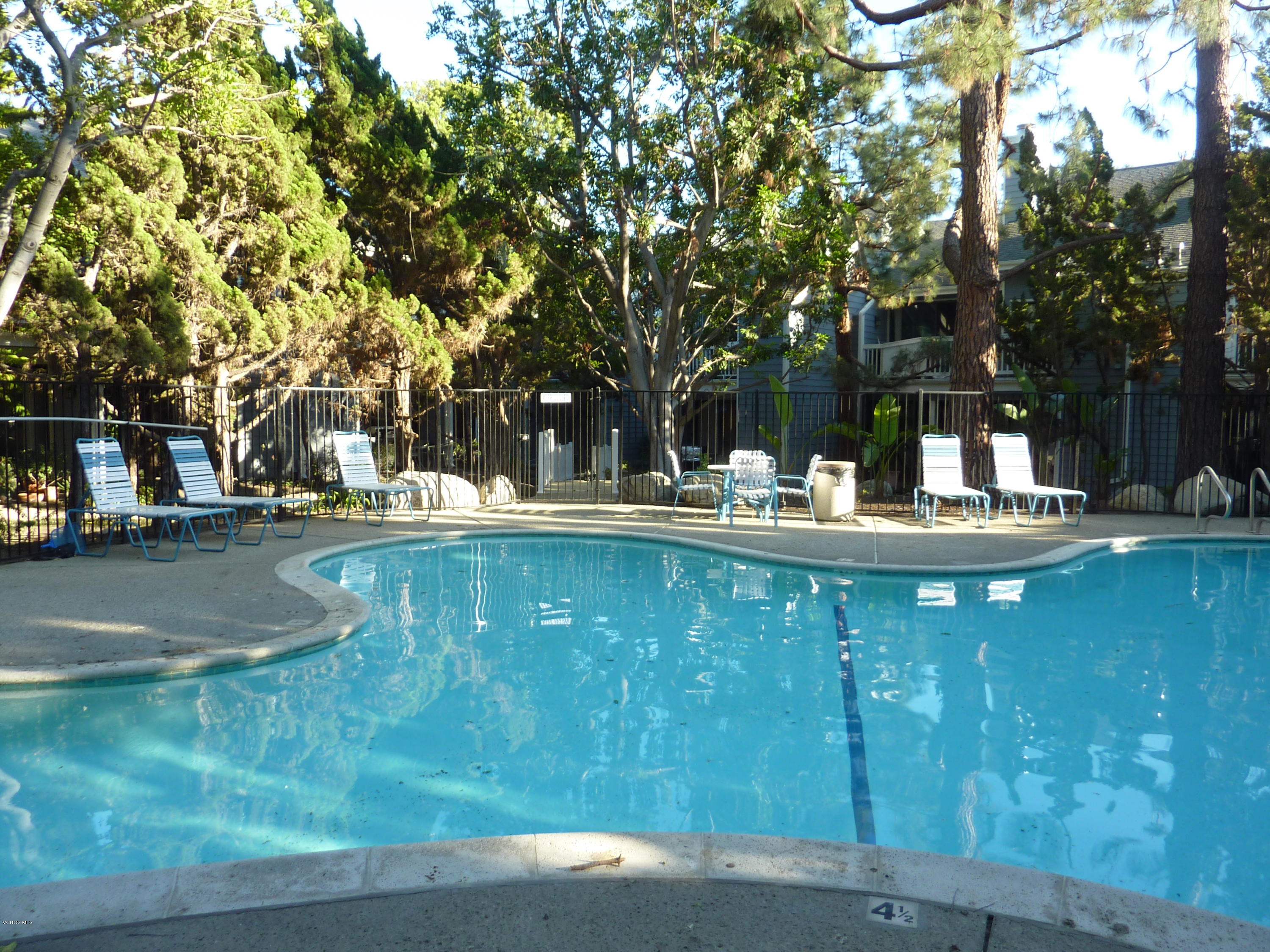 677 Arneill Road Camarillo, CA 93010 - Photo 37 of 40 a backyard of a house with table and chairs