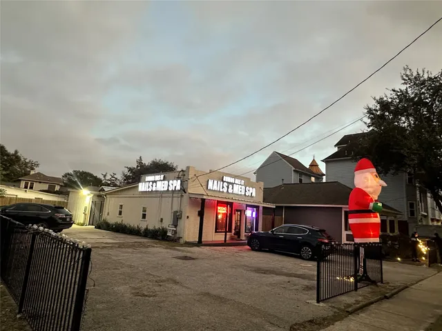 a view of a building with traffic signal lights