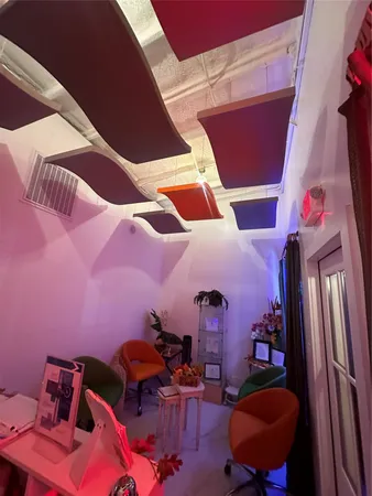 a backyard of a house with outdoor seating