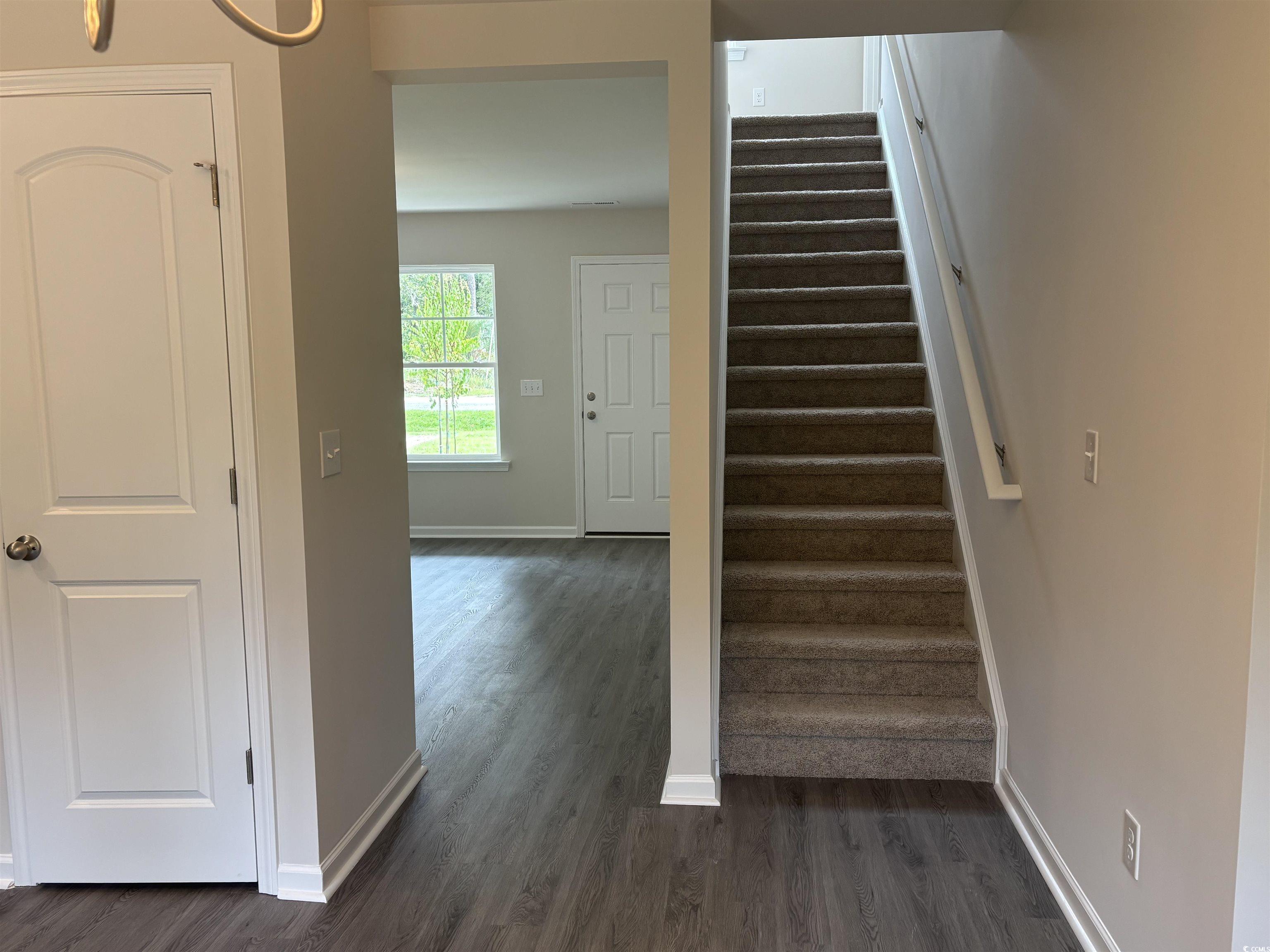 201 Kc Lane Aynor, SC 29511 - Photo 7 of 8 Staircase featuring wood finished floors and baseboards