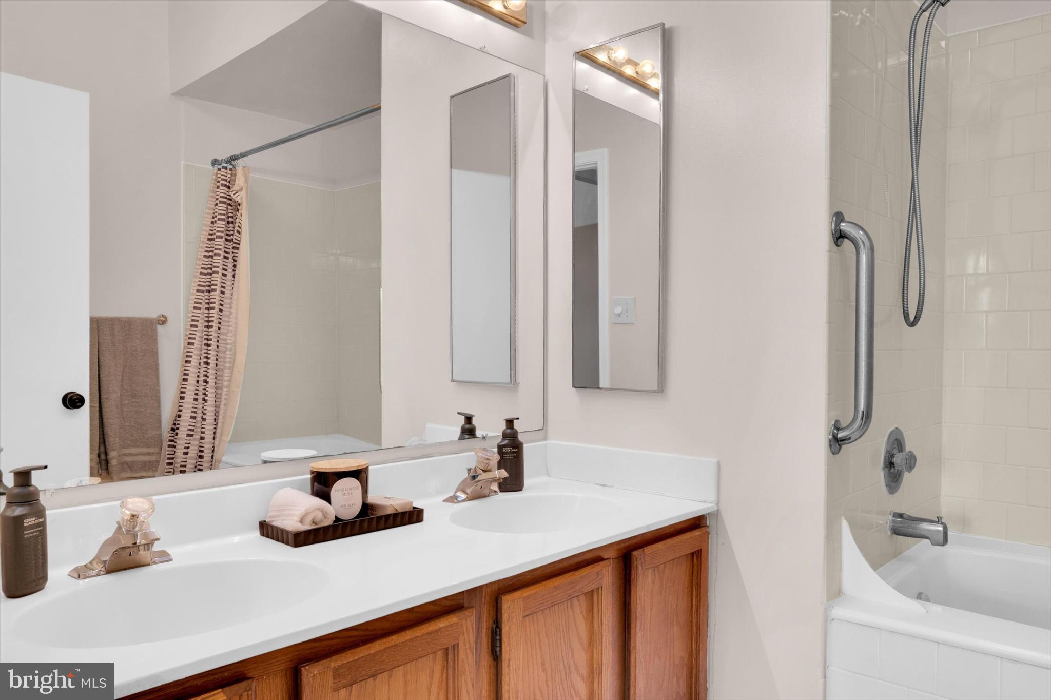 13201 Valley Bridge Court Silver Spring, MD 20906 - Photo 24 of 42 a bathroom with a sink and a mirror
