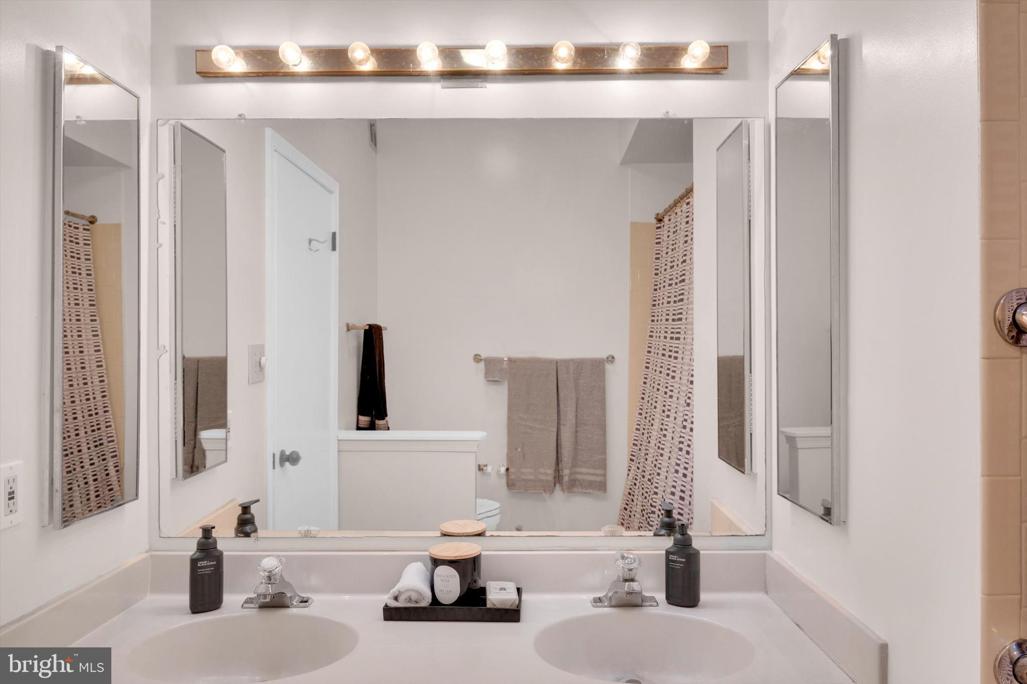 13201 Valley Bridge Court Silver Spring, MD 20906 - Photo 25 of 42 a bathroom with a sink and a mirror