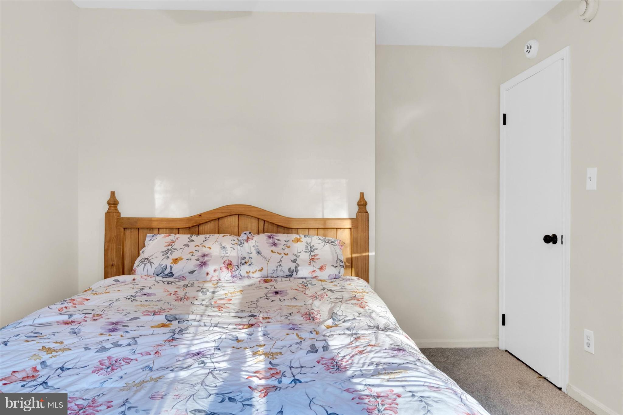 13201 Valley Bridge Court Silver Spring, MD 20906 - Photo 29 of 42 a bedroom with a bed and a window