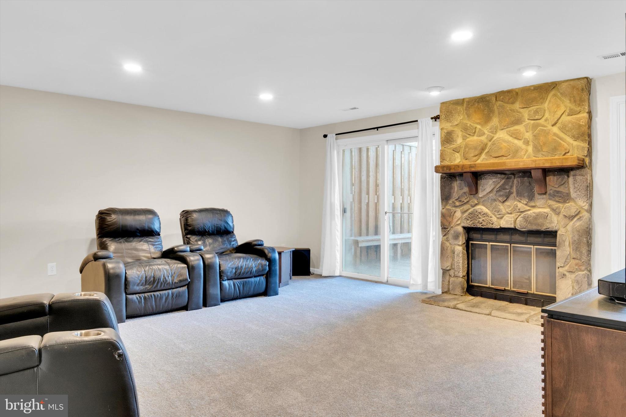 13201 Valley Bridge Court Silver Spring, MD 20906 - Photo 33 of 42 a living room with furniture and a fireplace