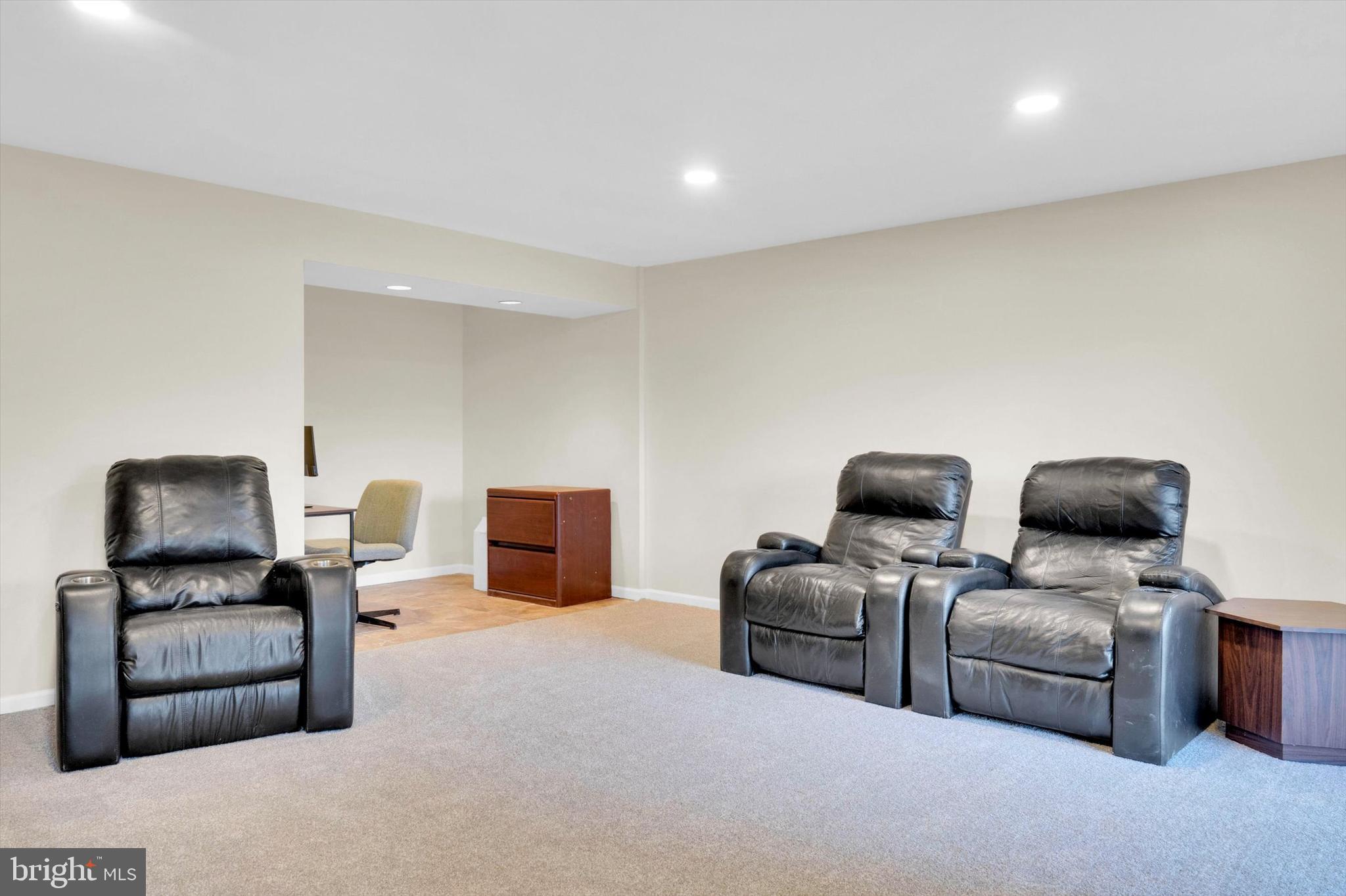 13201 Valley Bridge Court Silver Spring, MD 20906 - Photo 34 of 42 a living room with furniture and a flat screen tv