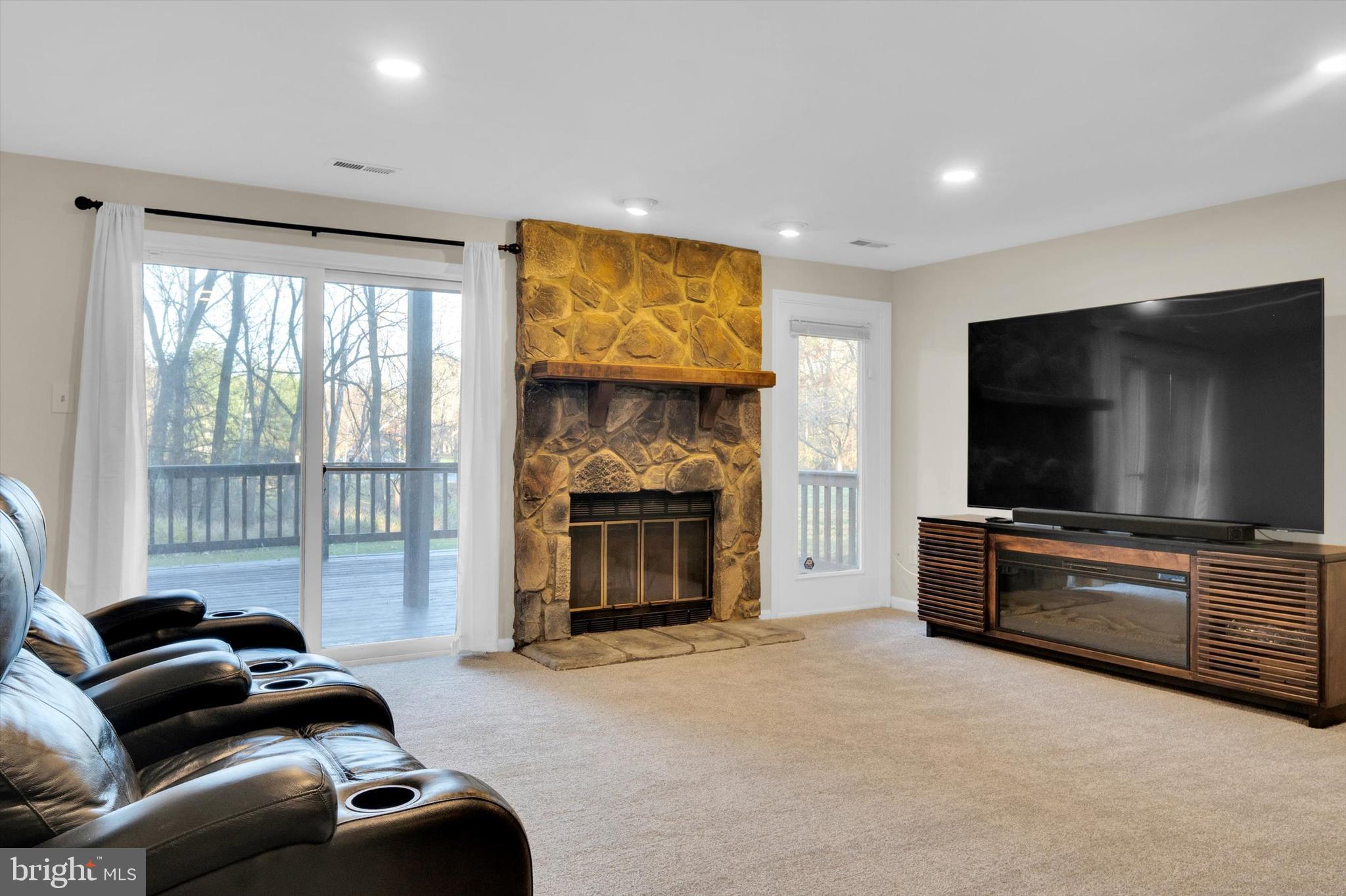 13201 Valley Bridge Court Silver Spring, MD 20906 - Photo 36 of 42 a living room with furniture and a flat screen tv