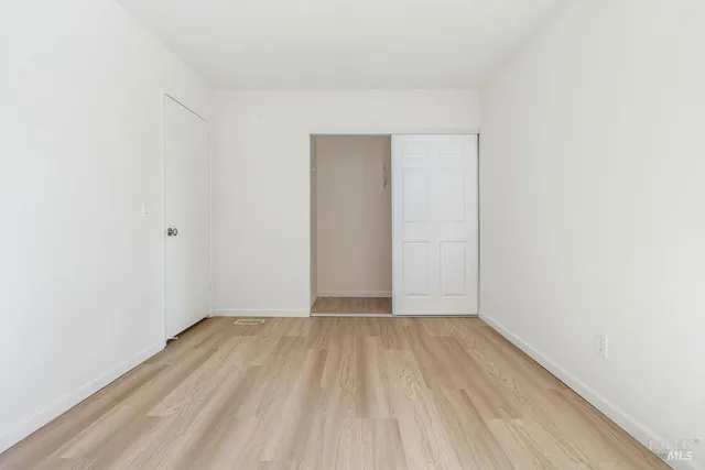 a view of a livingroom with wooden floor