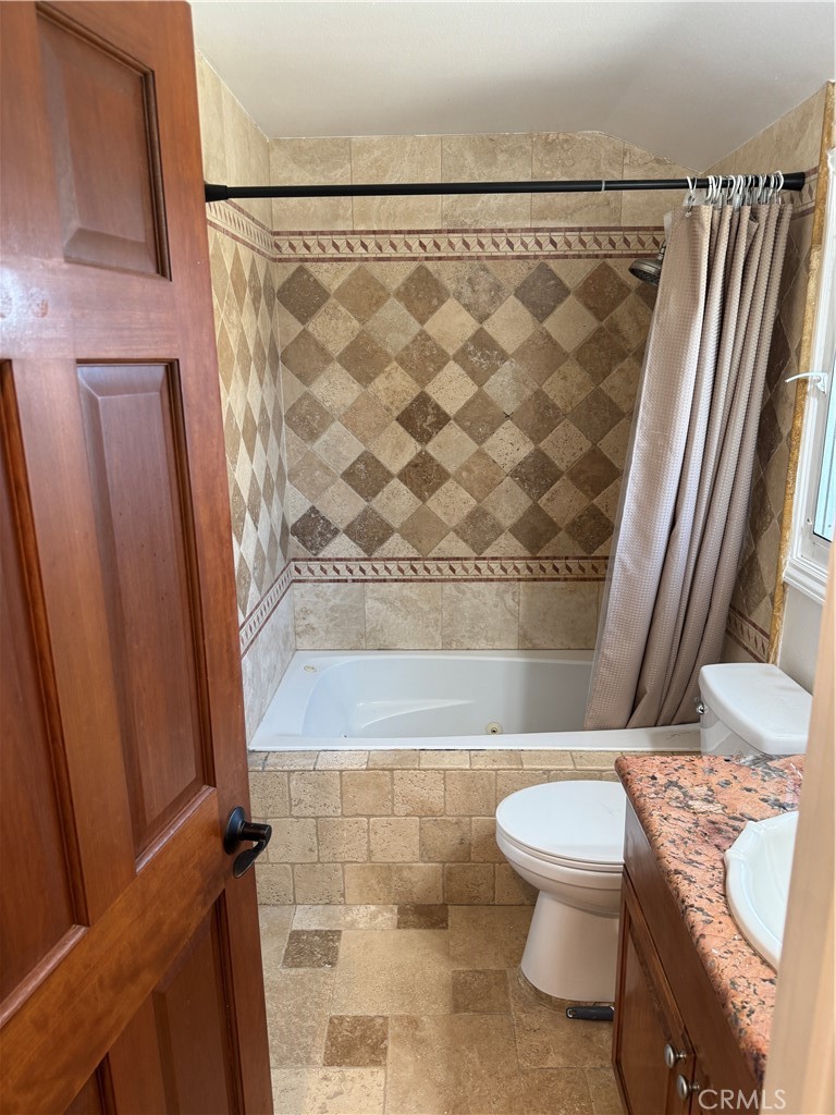 20182 Kline Drive Newport Beach, CA 92660 - Photo 20 of 39 a bathroom with a toilet and a shower