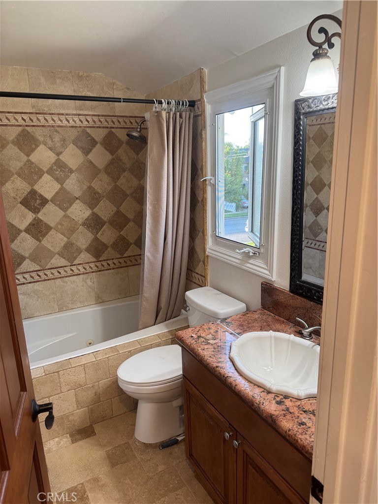 20182 Kline Drive Newport Beach, CA 92660 - Photo 21 of 39 a bathroom with a granite countertop sink toilet and shower
