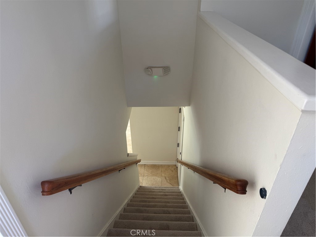 20182 Kline Drive Newport Beach, CA 92660 - Photo 25 of 39 a view of a hallway with wooden floor and a shower