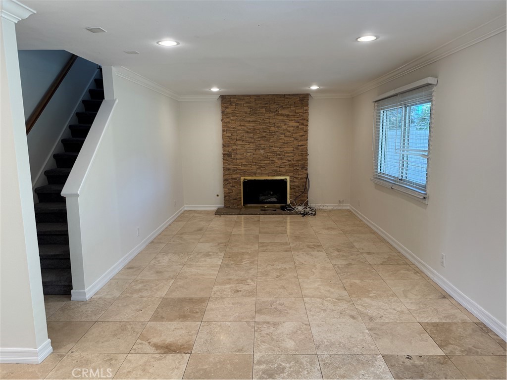 20182 Kline Drive Newport Beach, CA 92660 - Photo 7 of 39 a view of an empty room with a fireplace