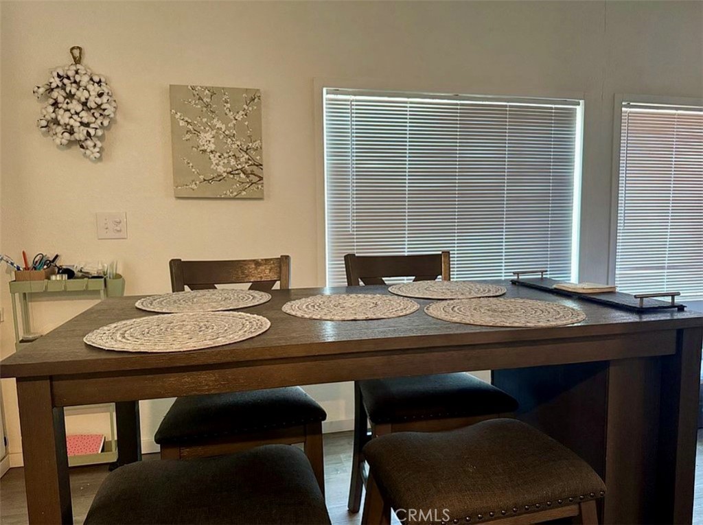 22601 Bear Valley Road, Unit 63 Apple Valley, CA 92308 - Photo 11 of 31 a table and chairs in a room