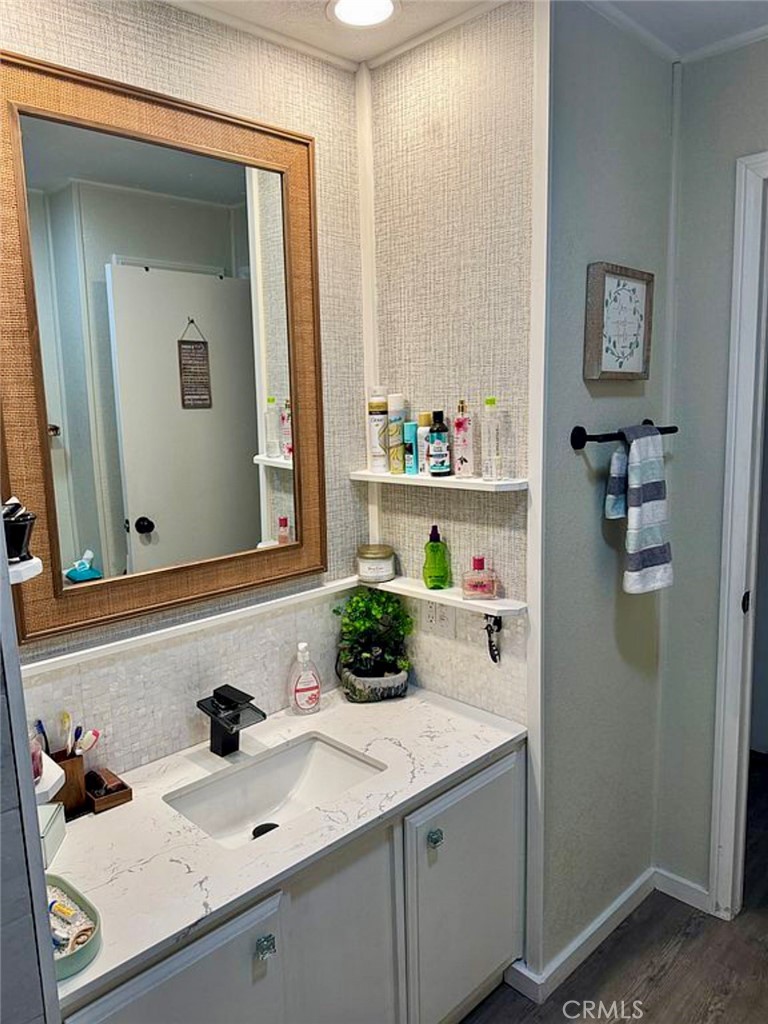 22601 Bear Valley Road, Unit 63 Apple Valley, CA 92308 - Photo 19 of 31 a bathroom with a sink and a mirror