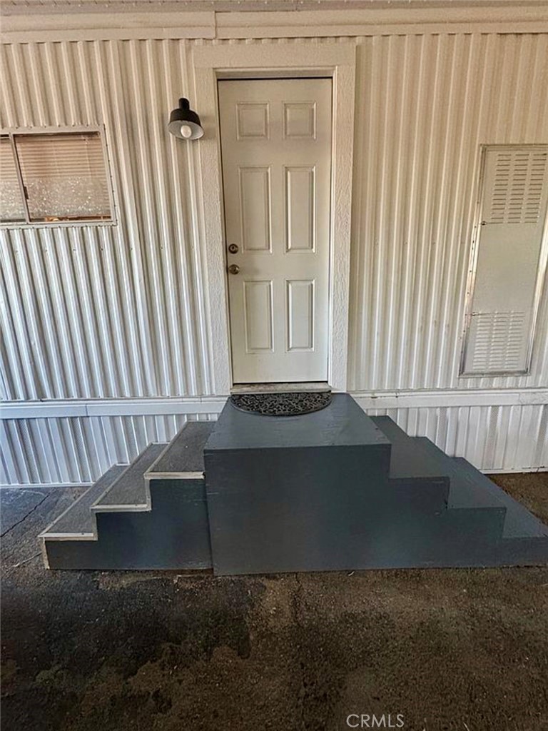 22601 Bear Valley Road, Unit 63 Apple Valley, CA 92308 - Photo 21 of 31 a view of staircase with white walls and a bathtub