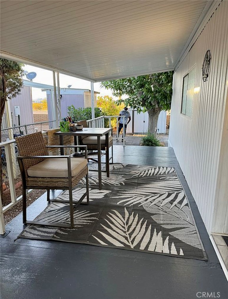 22601 Bear Valley Road, Unit 63 Apple Valley, CA 92308 - Photo 25 of 31 a living room with furniture and a large window