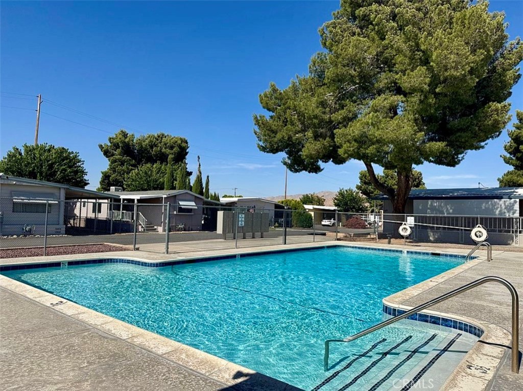 22601 Bear Valley Road, Unit 63 Apple Valley, CA 92308 - Photo 31 of 31 a view of a house with swimming pool having outdoor seating