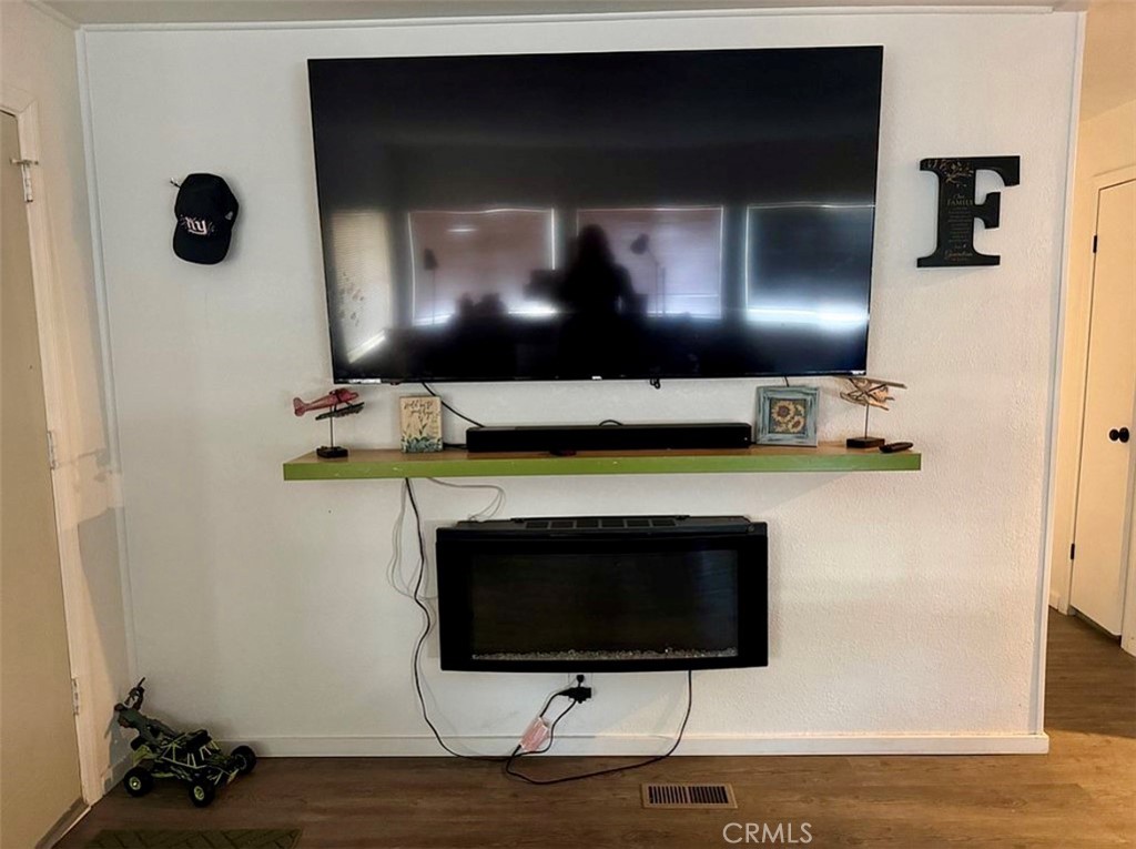 22601 Bear Valley Road, Unit 63 Apple Valley, CA 92308 - Photo 7 of 31 a living room with furniture and a fireplace