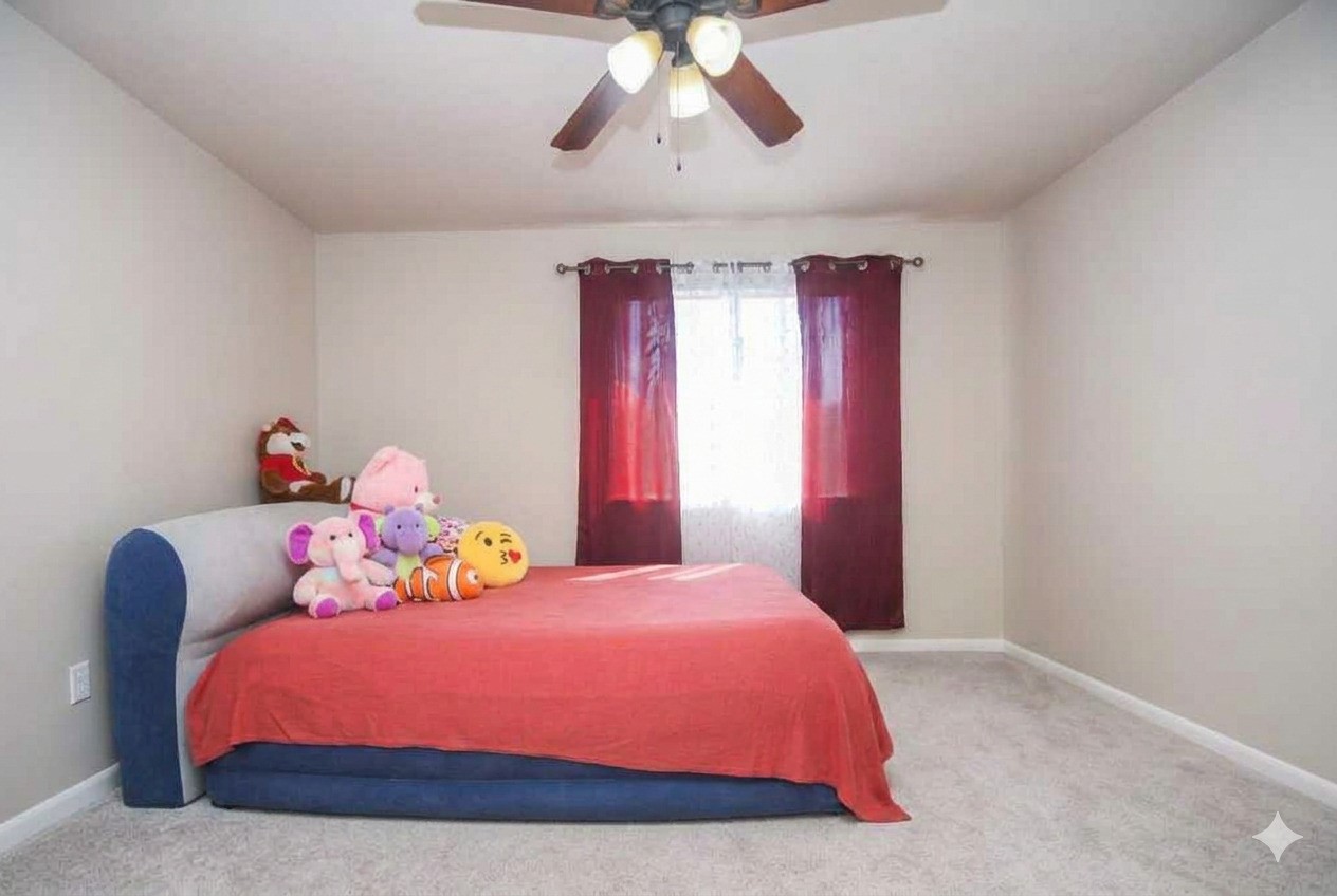 14407 Andrea Way Lane Houston, TX 77083 - Photo 17 of 29 This bright bedroom features a ceiling fan, and a window with red curtains, offering a warm and inviting atmosphere.