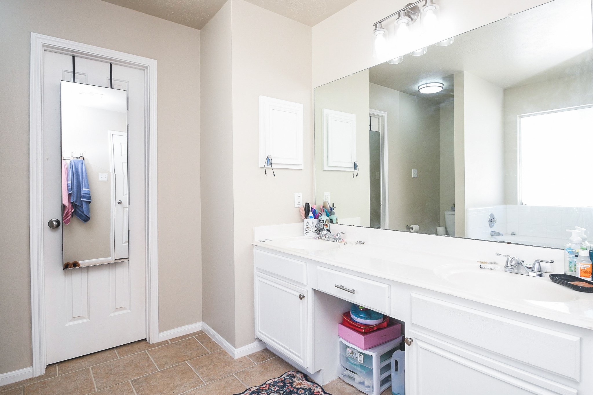 14407 Andrea Way Lane Houston, TX 77083 - Photo 24 of 29 a bathroom with a sink and a mirror