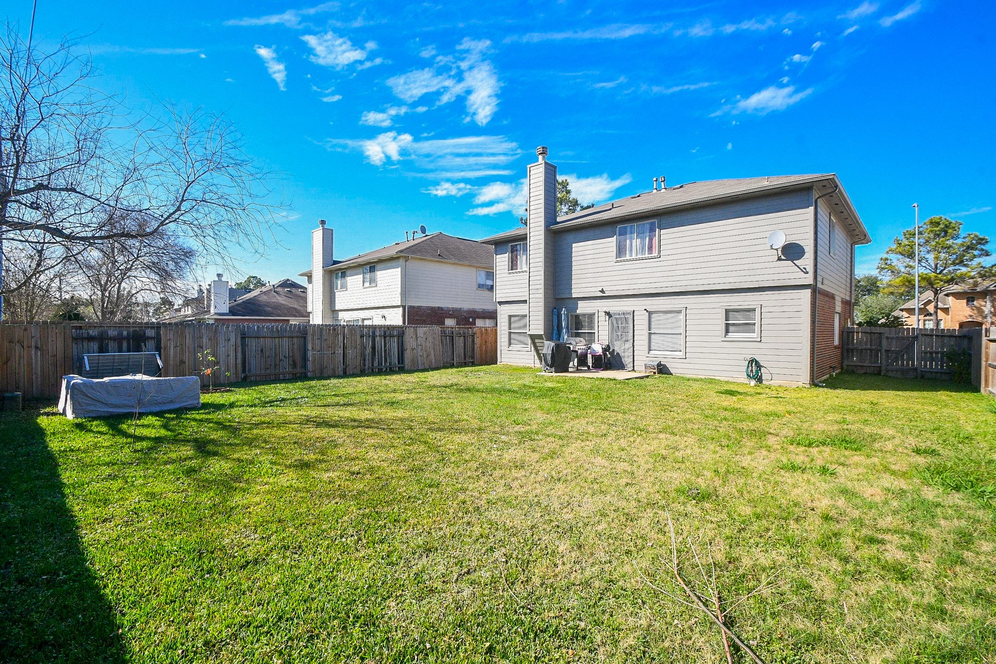14407 Andrea Way Lane Houston, TX 77083 - Photo 28 of 29 a view of a house with backyard and sitting area