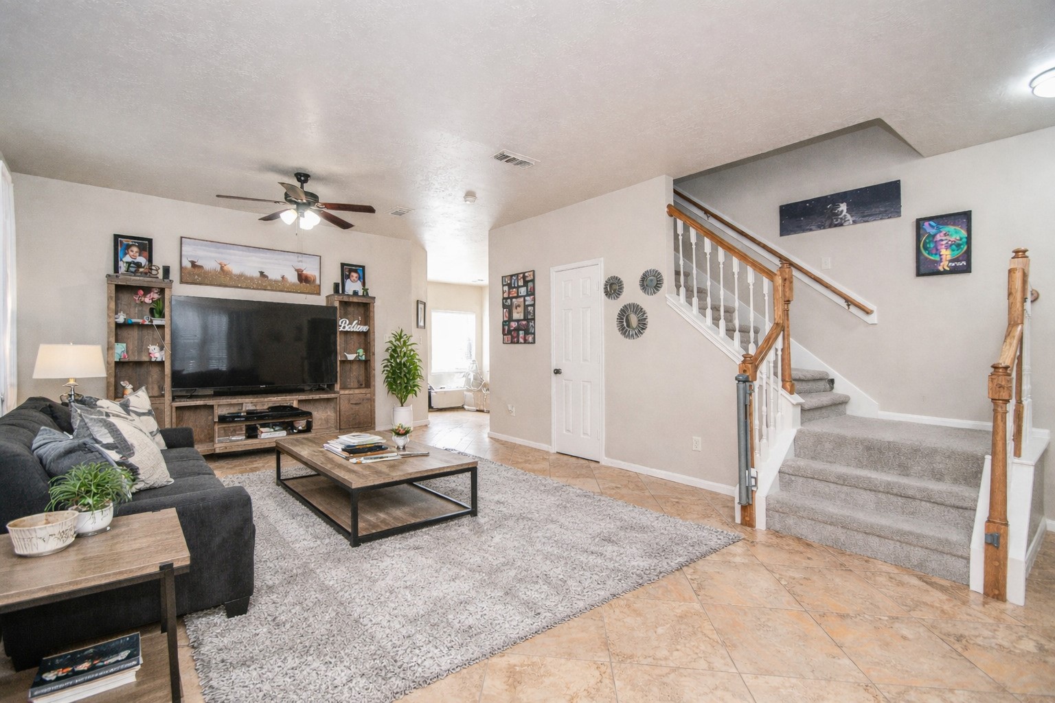 14407 Andrea Way Lane Houston, TX 77083 - Photo 4 of 29 a living room with furniture and a flat screen tv
