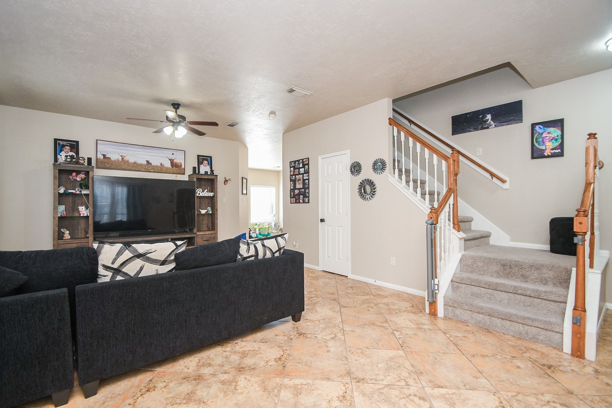 14407 Andrea Way Lane Houston, TX 77083 - Photo 5 of 29 a living room with furniture and a flat screen tv