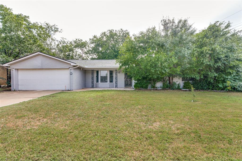1904 Old Kirk Road Bedford, TX 76022 - Photo 1 of 25 a view of a house with a backyard