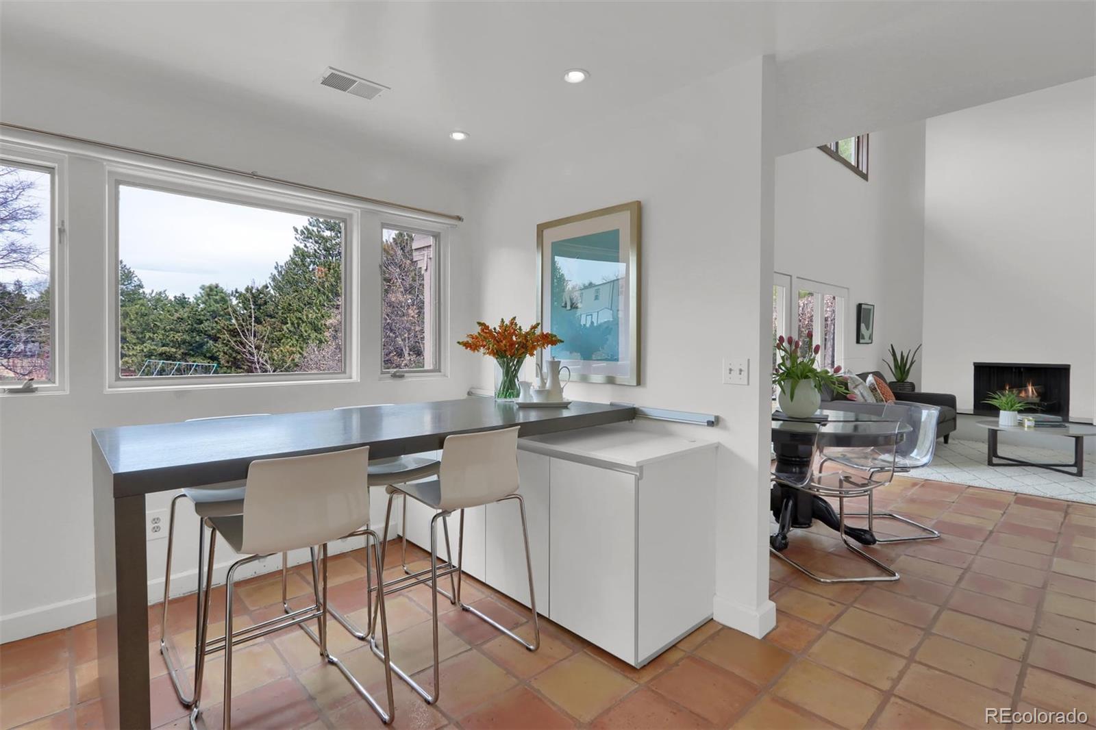 855 Front Range Road Littleton, CO 80120 - Photo 12 of 34 a view of a dining room with furniture window and outside view