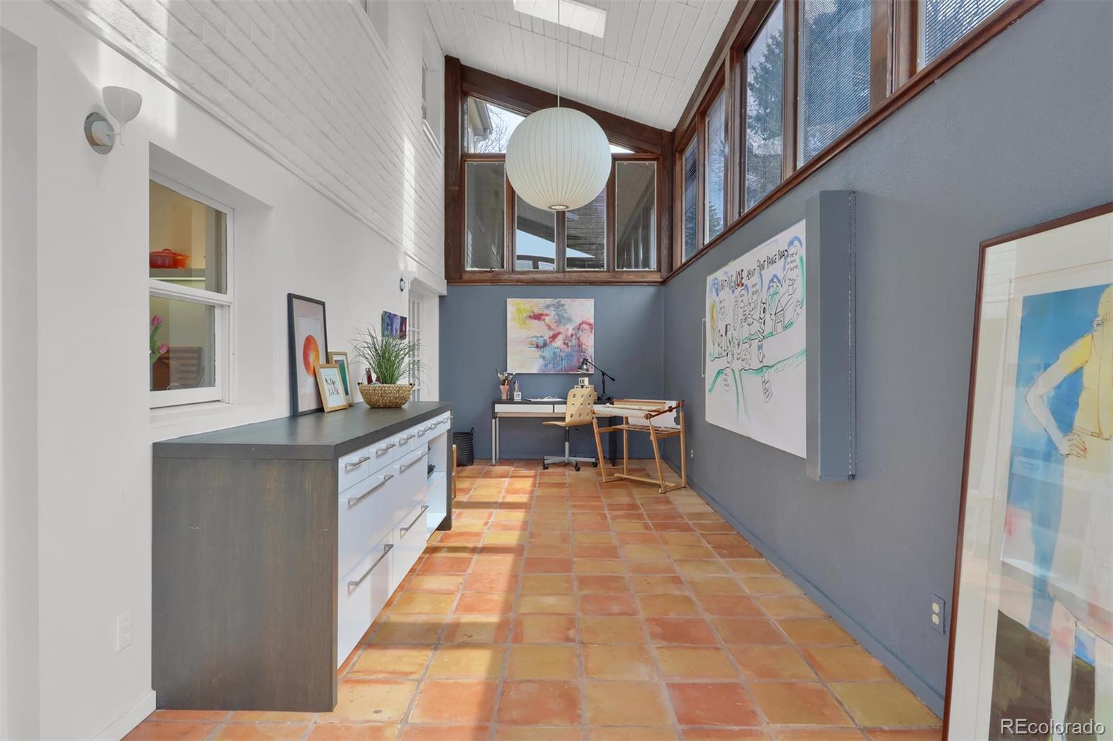 855 Front Range Road Littleton, CO 80120 - Photo 18 of 34 a view of living room with furniture and a mirror