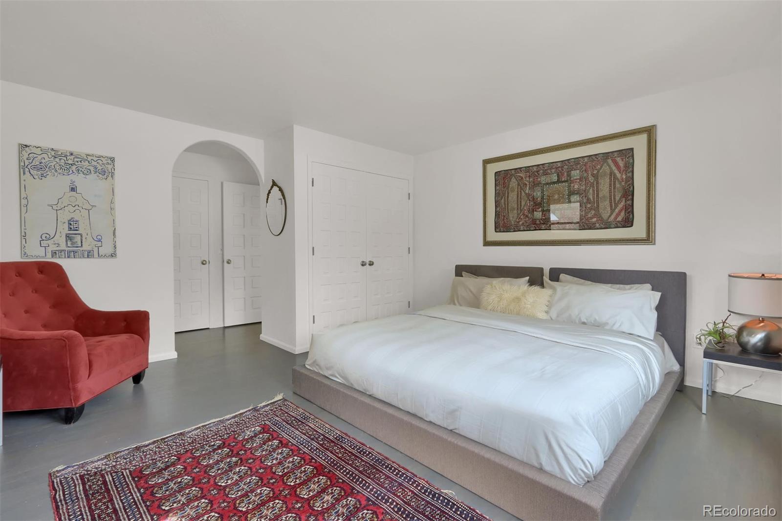 855 Front Range Road Littleton, CO 80120 - Photo 21 of 34 a bedroom with bed and window