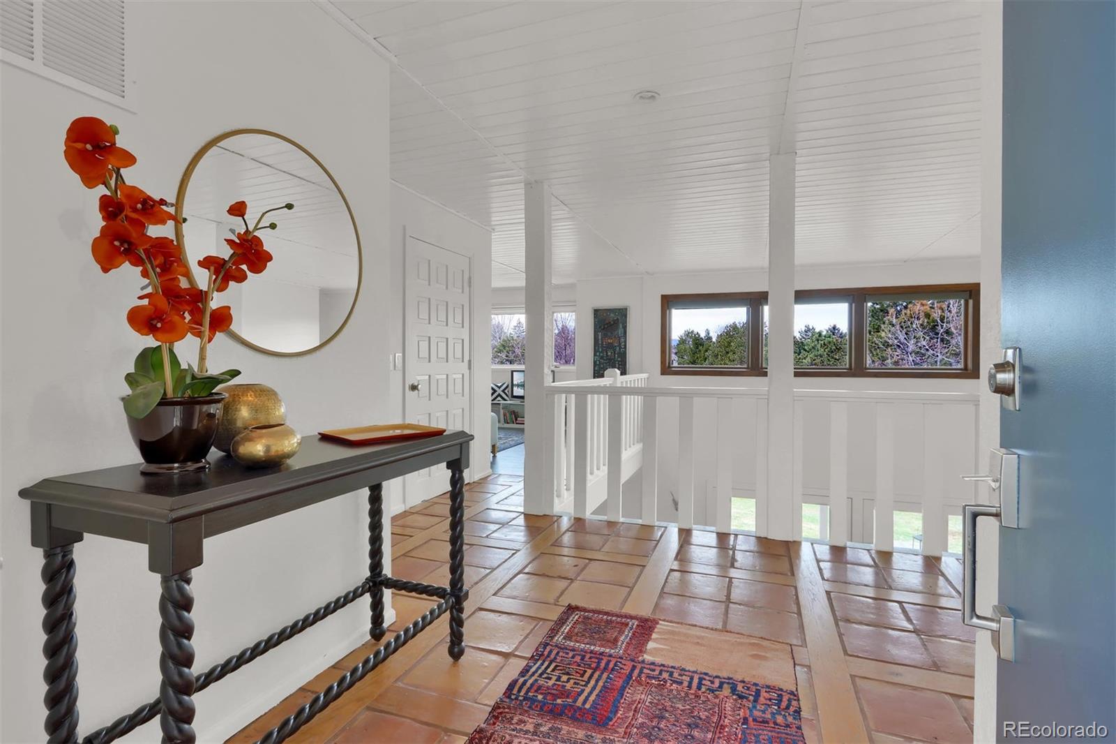 855 Front Range Road Littleton, CO 80120 - Photo 3 of 34 a front view of a house