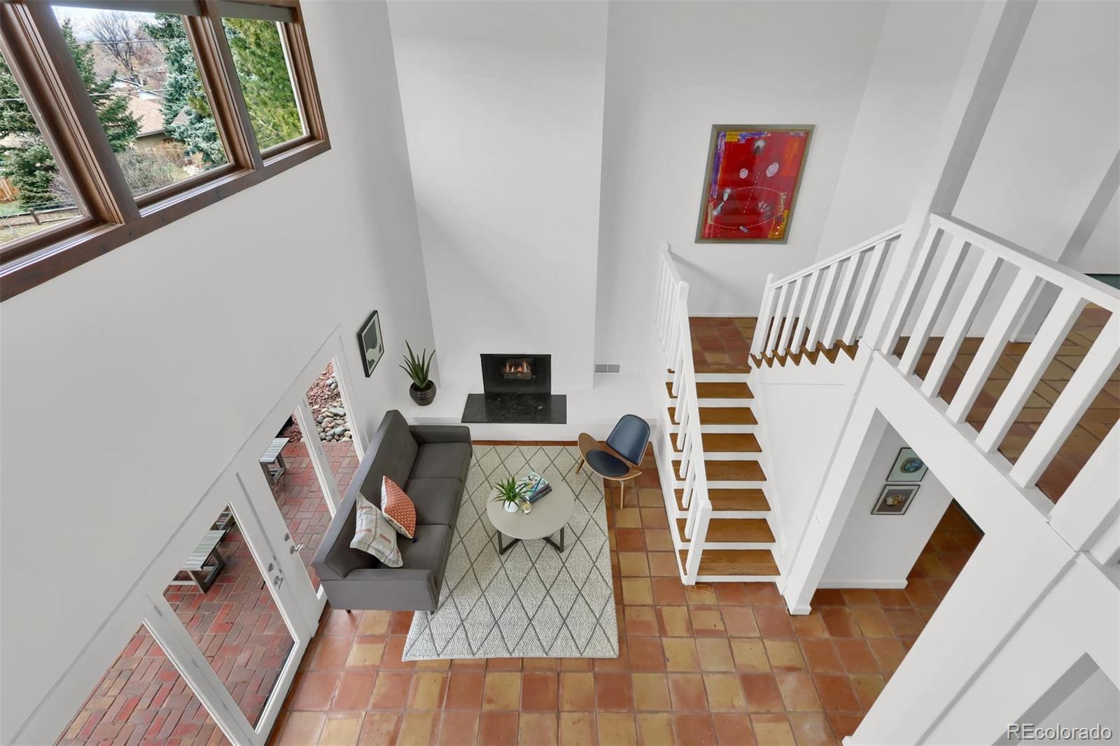 855 Front Range Road Littleton, CO 80120 - Photo 4 of 34 a view of an entryway with wooden floor