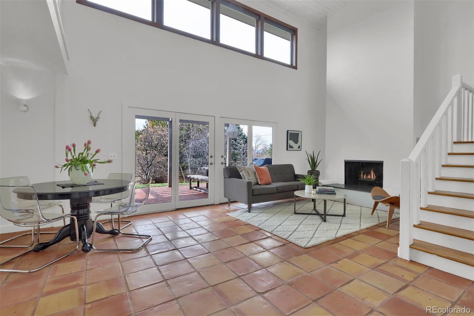 855 Front Range Road Littleton, CO 80120 - Photo 6 of 34 a living room with furniture and a potted plant