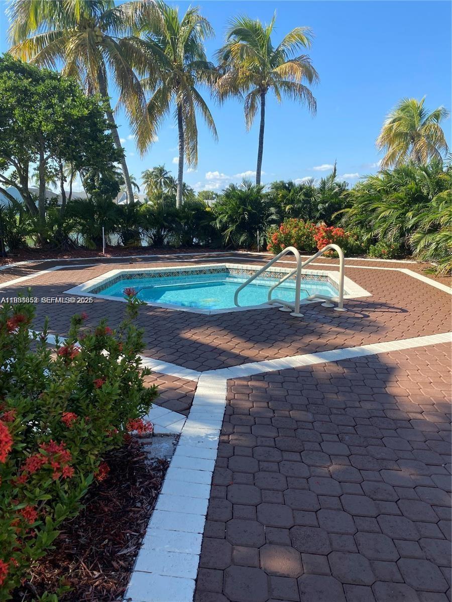540 Southeast 21st Lane, Unit 540 Homestead, FL 33033 - Photo 12 of 14 a view of a yard and entertaining space