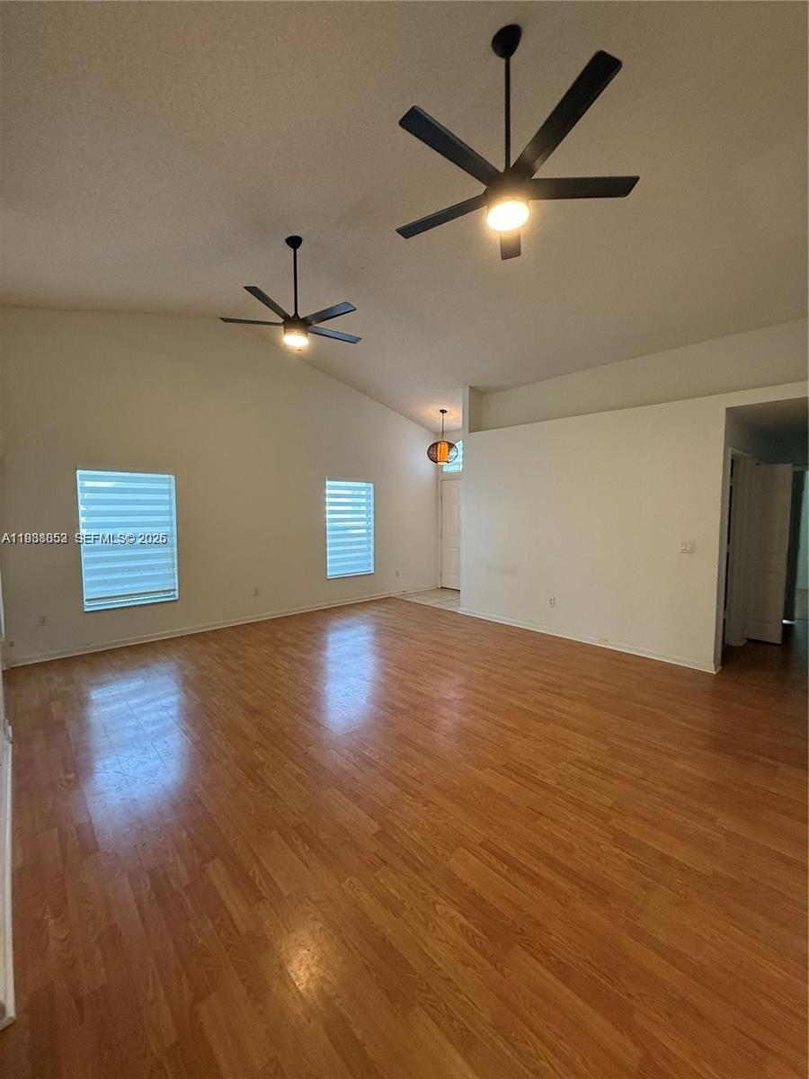 540 Southeast 21st Lane, Unit 540 Homestead, FL 33033 - Photo 2 of 14 a view of a ceiling fan with wooden floor