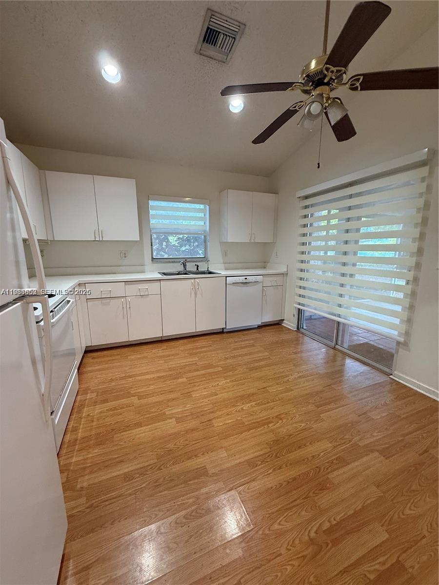 540 Southeast 21st Lane, Unit 540 Homestead, FL 33033 - Photo 6 of 14 a view of a kitchen with electric appliances