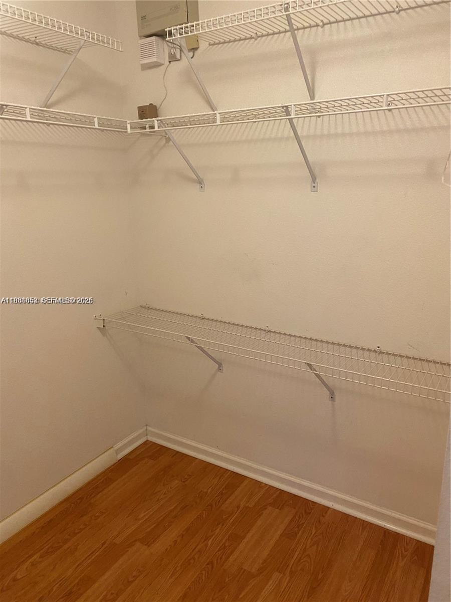 540 Southeast 21st Lane, Unit 540 Homestead, FL 33033 - Photo 7 of 14 a view of a room with racks on the wall