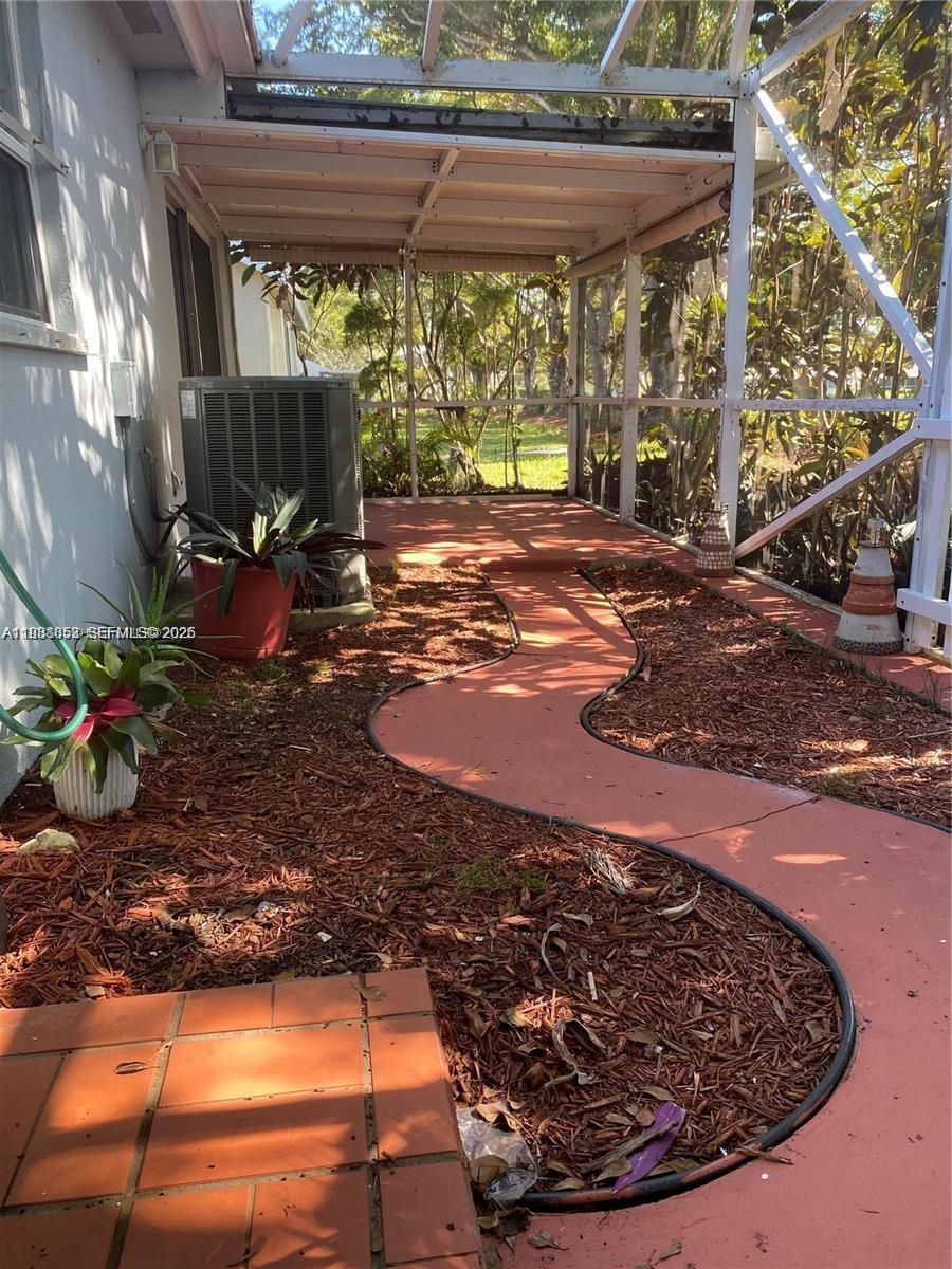 540 Southeast 21st Lane, Unit 540 Homestead, FL 33033 - Photo 10 of 14 a view of a porch with a yard