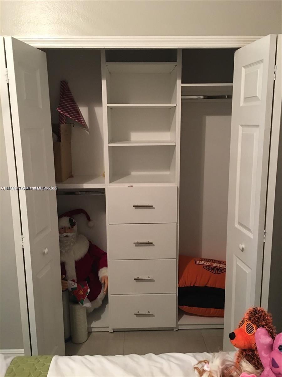 16124 Southwest 55th Terrace Miami, FL 33185 - Photo 20 of 23 a view of walk in closet