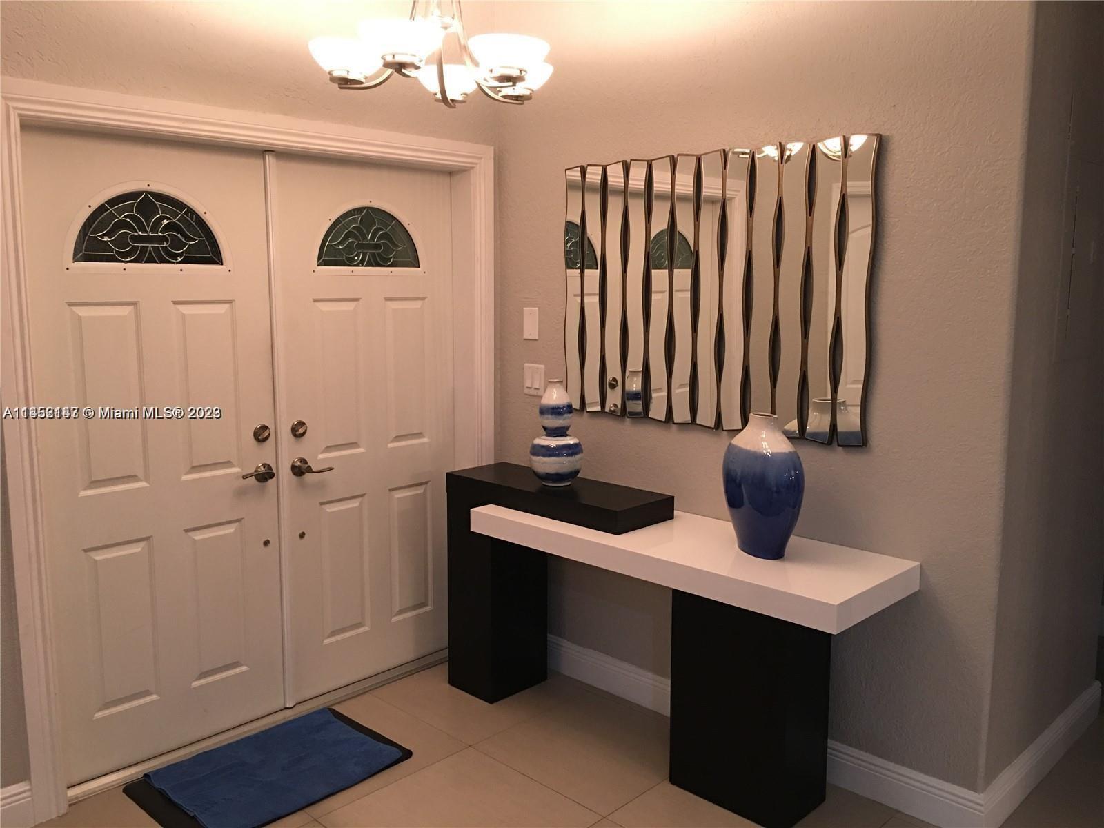 16124 Southwest 55th Terrace Miami, FL 33185 - Photo 5 of 23 a view of living room with furniture and wooden floor