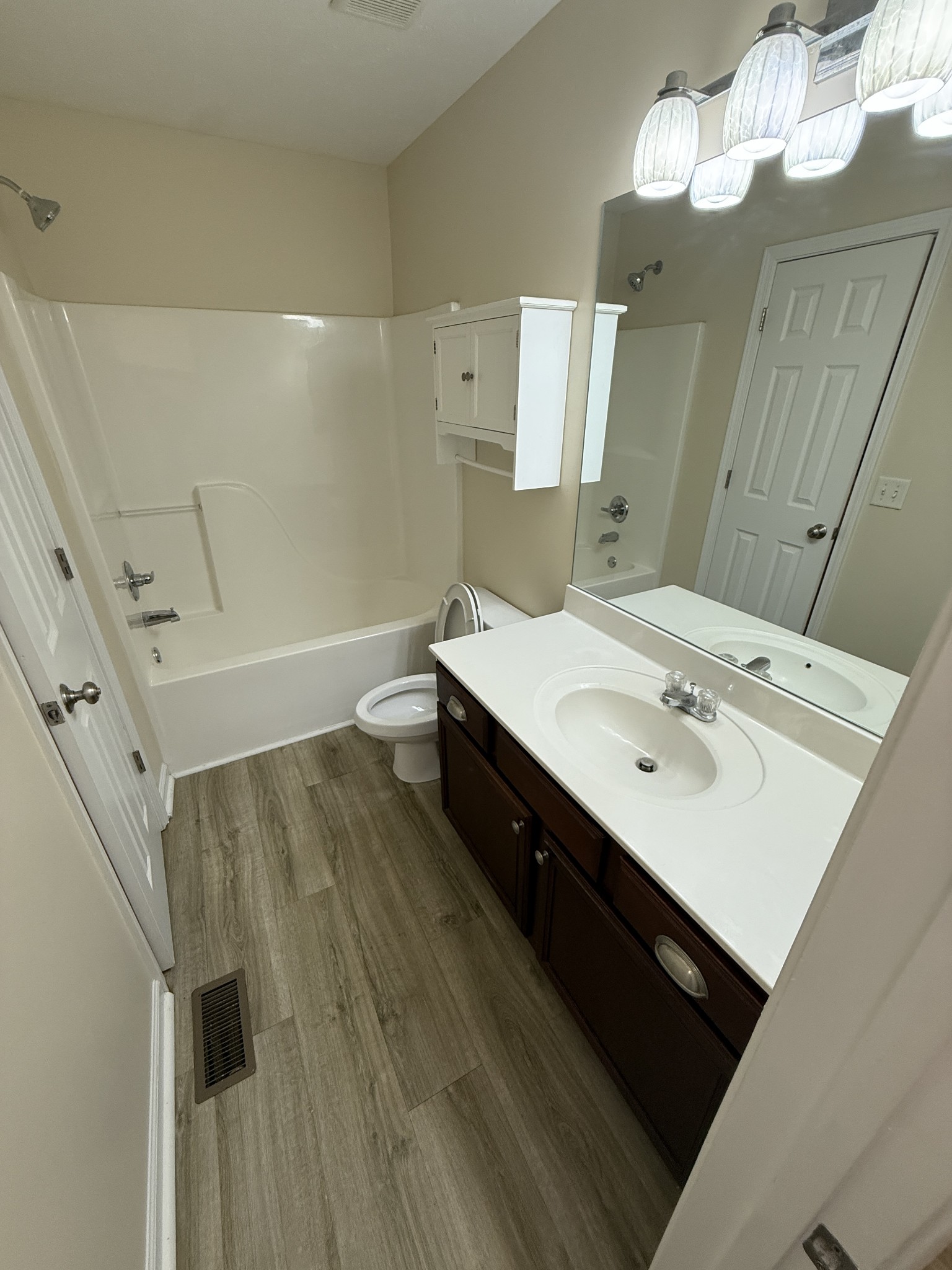 1040 Shaman Crossing Murfreesboro, TN 37128 - Photo 16 of 20 a bathroom with a sink a mirror and a bathtub