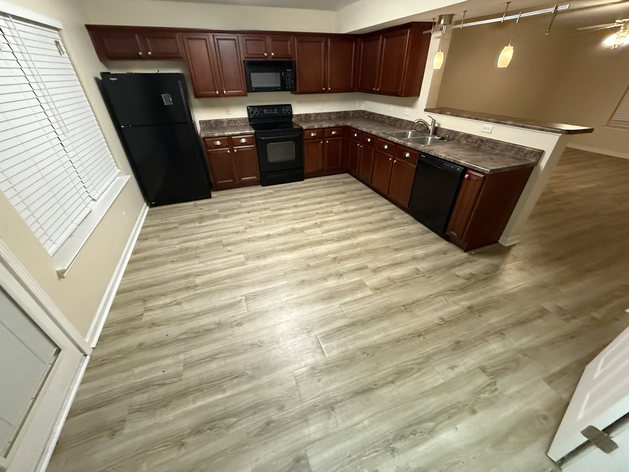 1040 Shaman Crossing Murfreesboro, TN 37128 - Photo 4 of 20 a kitchen with stainless steel appliances granite countertop a stove a sink and a refrigerator
