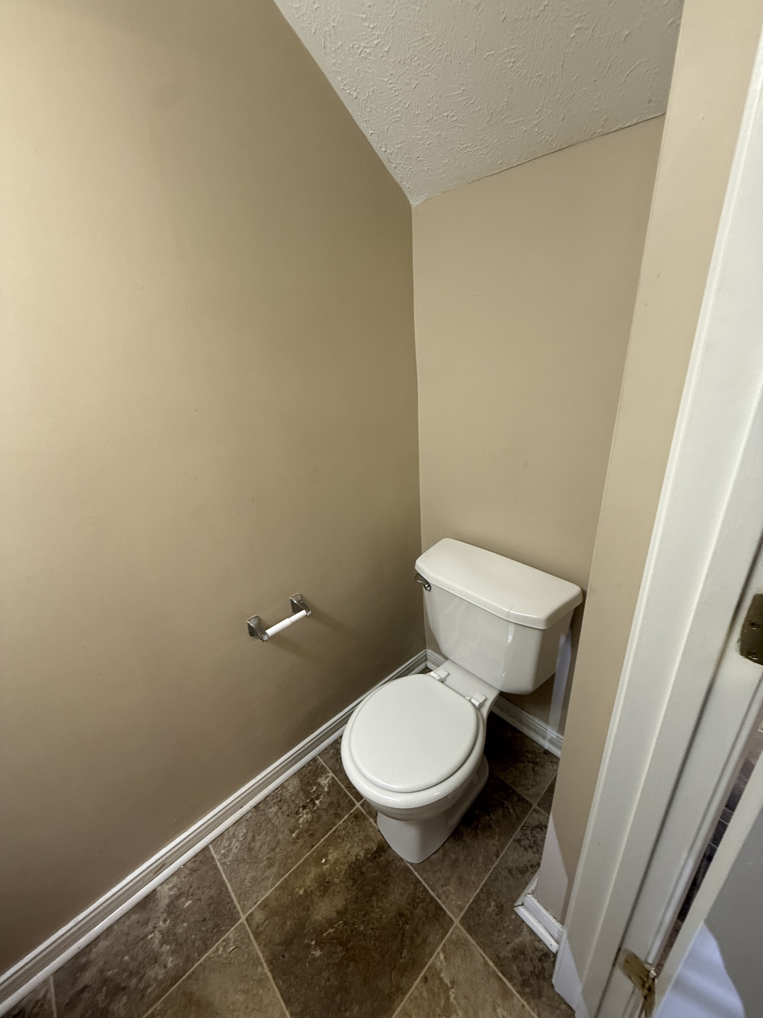 1040 Shaman Crossing Murfreesboro, TN 37128 - Photo 8 of 20 a white toilet sitting next to a small sink